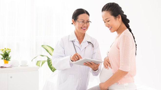 pregnant woman at doctors insurance